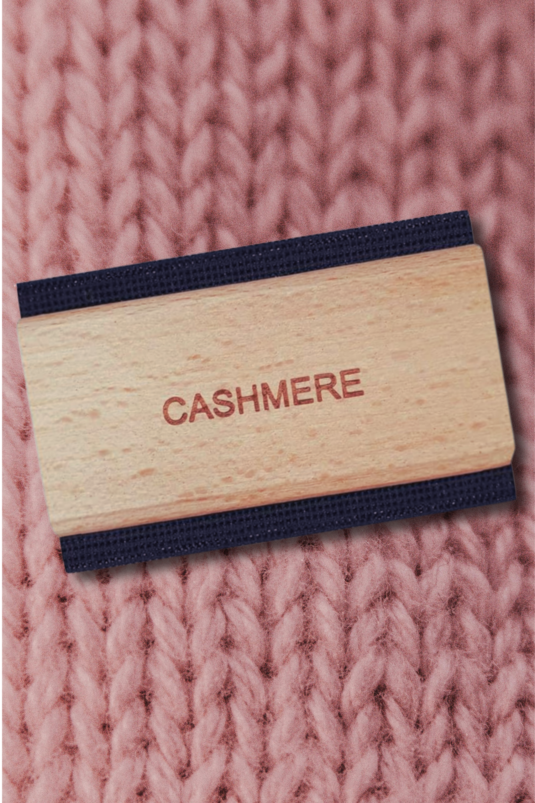 wooden cashmere comb on pink knit