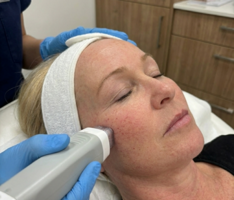 woman getting a facial skin treatment in a clinic